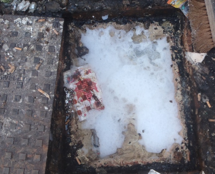 A manhole cover full of fat - Image courtesy of Severn Trent Water